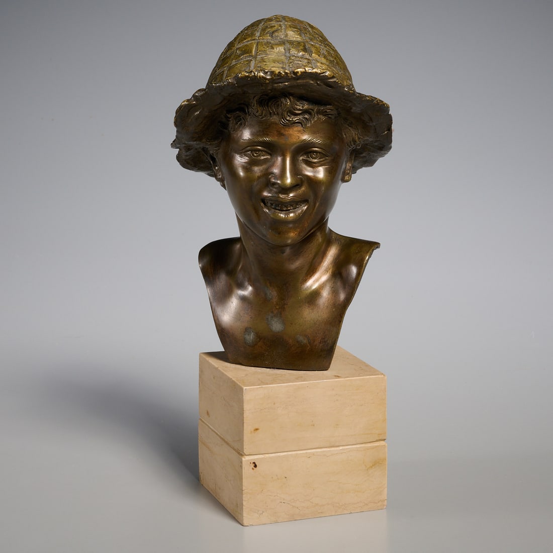 Vincenzo Cinque, patinated bronze bust: Vincenzo Cinque, patinated bronze bust, Vincenzo Cinque (Italian, 1852-1929), Boy with Hat, signed "VC" on shoulder, mounted on stone base, 7.25"h (bronze), 10.25"h x 4.5"w x 5"d (overall)
