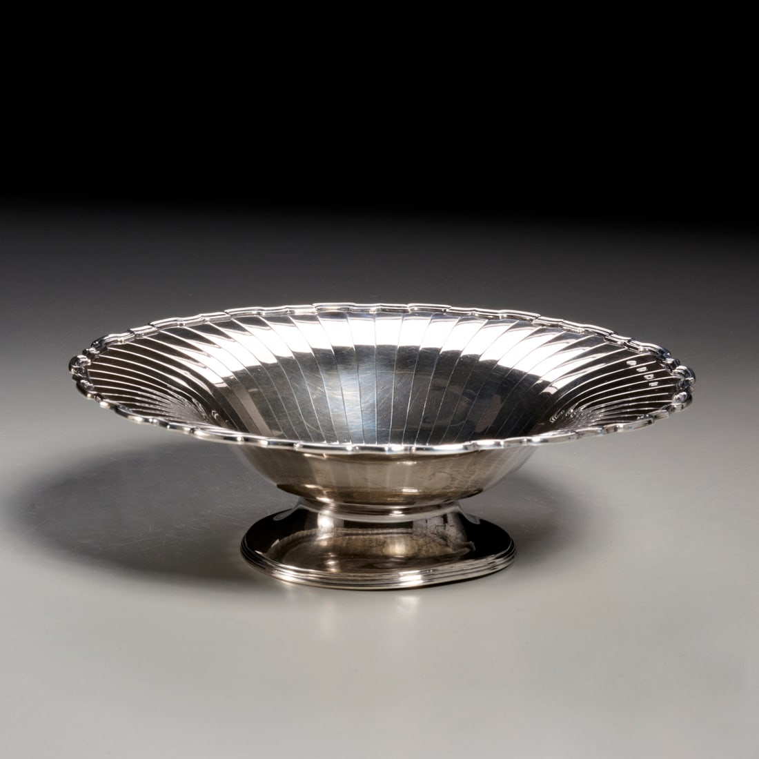 English sterling silver pedestal bowl: English sterling silver pedestal bowl, Birmingham, letter dated 1926, maker's mark of Adie Bros. Ltd., 2.5"h x 8"dia, approx. 8.2ozt.
