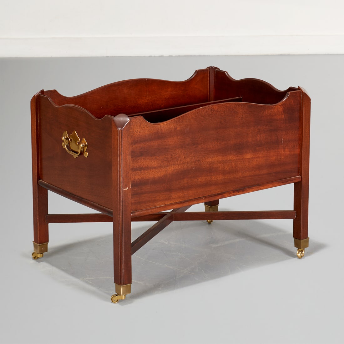 Chippendale style mahogany canterbury: Chippendale style mahogany canterbury, 20th c., divided interior, on casters, unmarked, 17"h x 22"w x 15"d