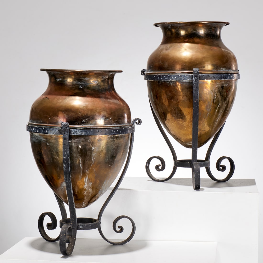 Pair large brass amphoras on stands: Pair large brass amphoras on stands, 20th c., unmarked, each 22.5"h x 14"dia Provenance: A Private Collection: 115 Central Park West, NYC