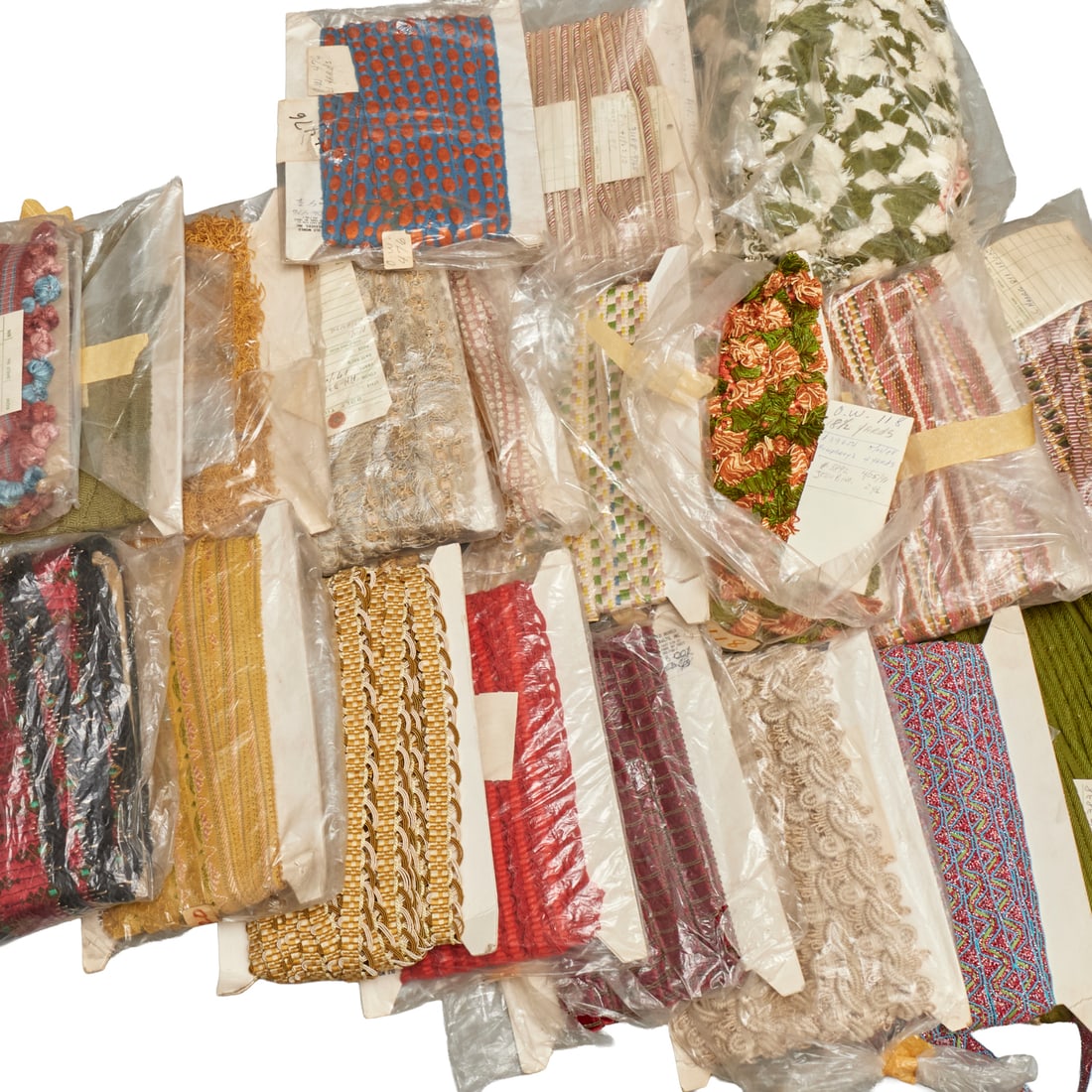 Fine vintage textile trims & finishes, ex Apfel: Fine vintage textile trims & finishes, ex Apfel, 20th c., (20) pieces, various styles and lengths, some Old World Weaver tags, ex Iris Apfel, most approx. 8"h x 12"w (cardboard packages) Provenance:
