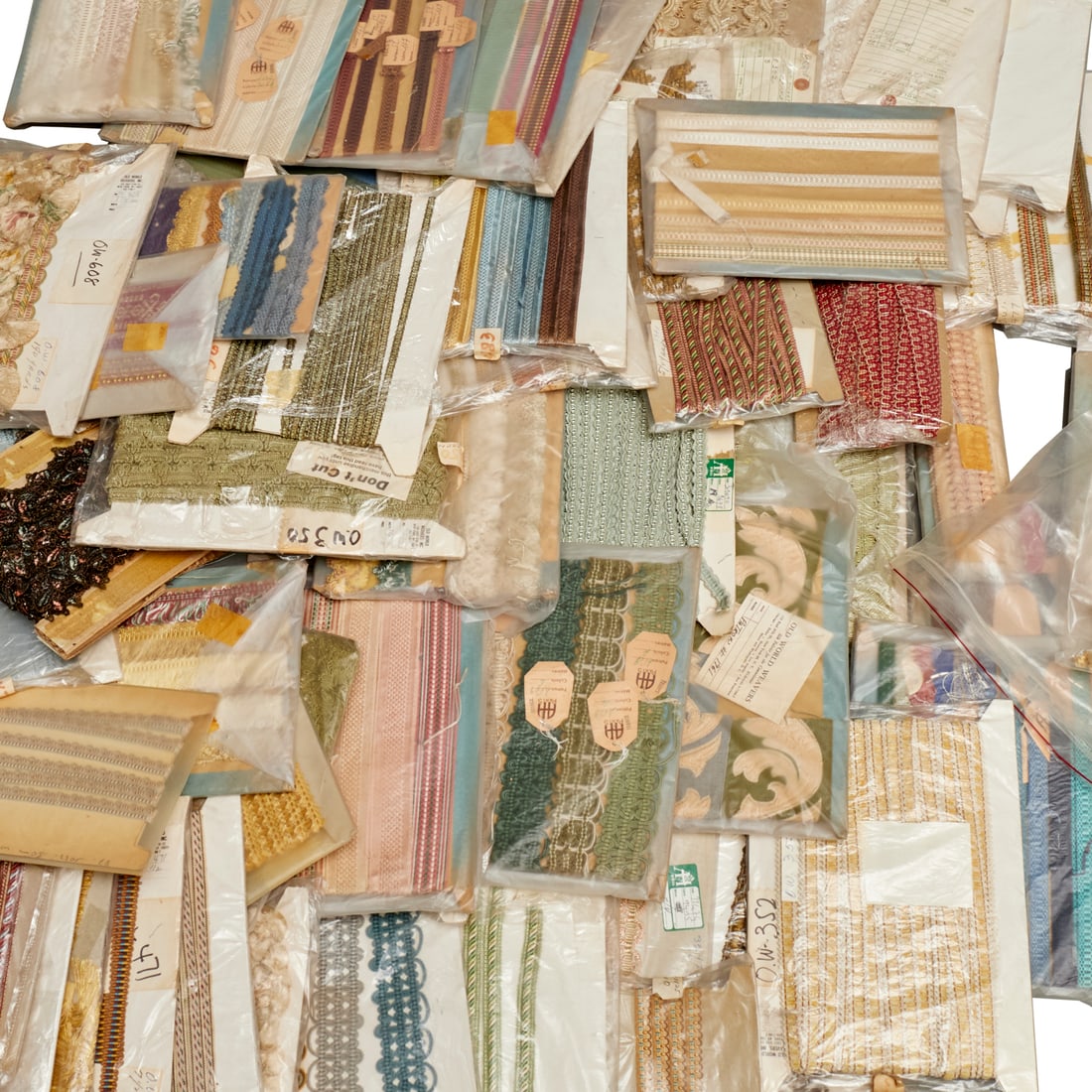 Huge group fine vintage textile trims & finishes: Huge group fine vintage textile trims & finishes, 20th c., (50+) pieces, various styles and lengths, many appear to be samples or small amounts wrapped on cardboard, incl. some Old World Weaver and