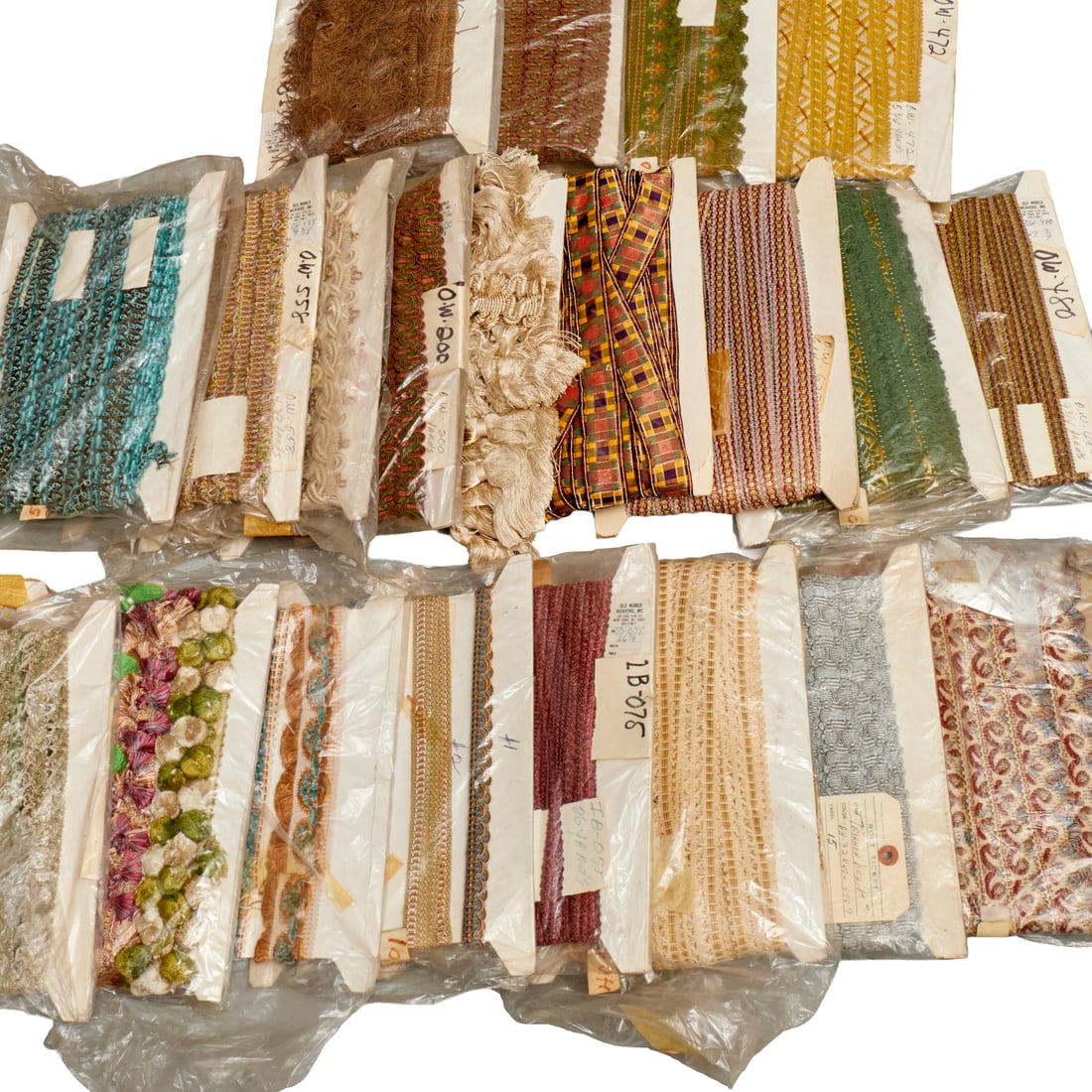 Fine vintage textile trims & finishes, ex Apfel: Fine vintage textile trims & finishes, ex Apfel, 20th c., (22) pieces, various styles and lengths, some Old World Weaver tags, ex Iris Apfel, most approx. 8"h x 12"w (cardboard packages) Provenance: