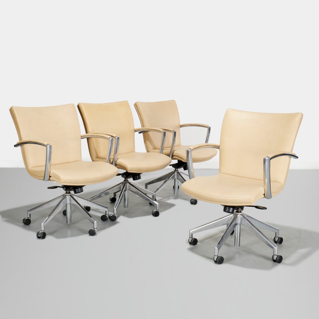 (4) Harter executive chairs: (4) Harter executive chairs, c. 2008, adjustable height and swivel chromed metal frames, with Ultrafabrics Brisa Distressed Chamois Fabric (faux leather), label under seat cushion, 36-40" (adjustable 