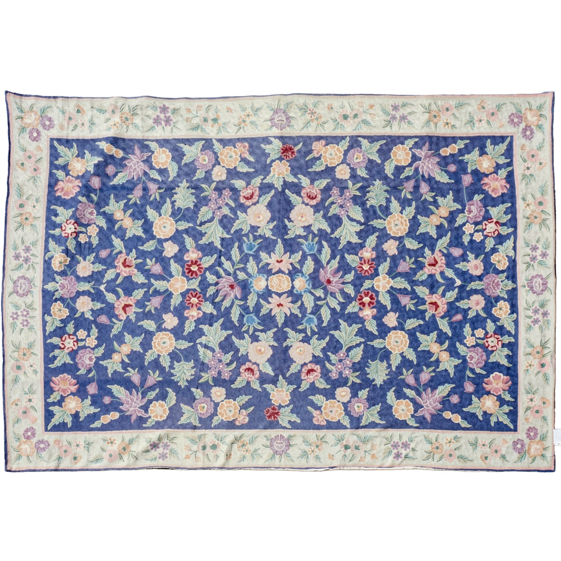 Floral chain stitched rug: Floral chain stitched rug, 20th c., on indigo ground, unmarked, approx. 8'11"l x 5'11"w