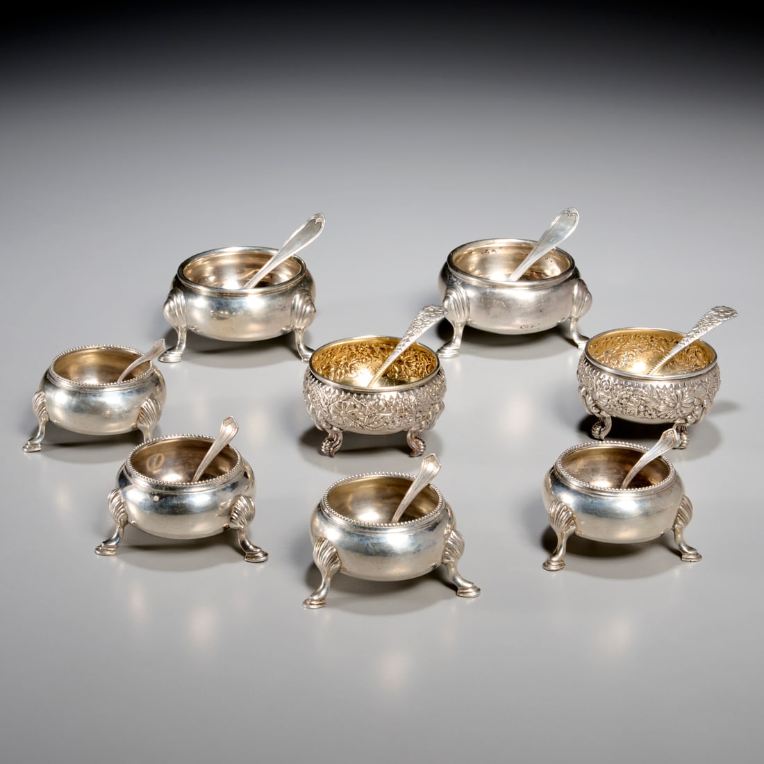 Group American & English sterling silver salts: Group American & English sterling silver salts, 19th/20th c., (8) pieces, incl. a pair of Horace Woodward & Co. master salts, c. 1913, London, with Bigelow Bros. & Kenny spoons, 1.75"h x 3"dia, a pair