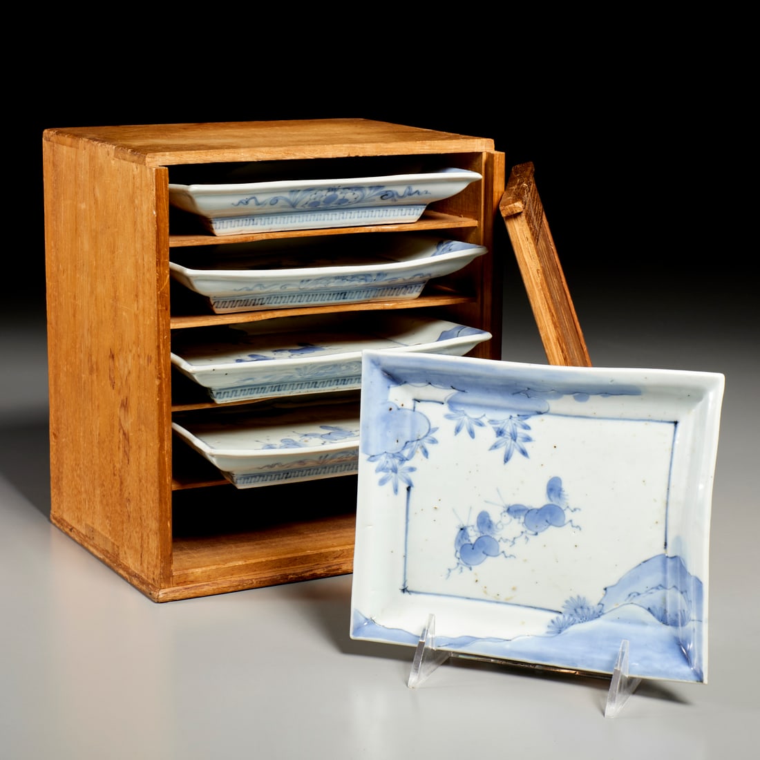 Antique Japanese Arita blue & white dish set: Antique Japanese Arita blue & white dish set, Edo Period (19th c. or earlier), footed rectangular dishes with flaring rims, decorated with running horses and mountains, underglaze Fuku mark underneath