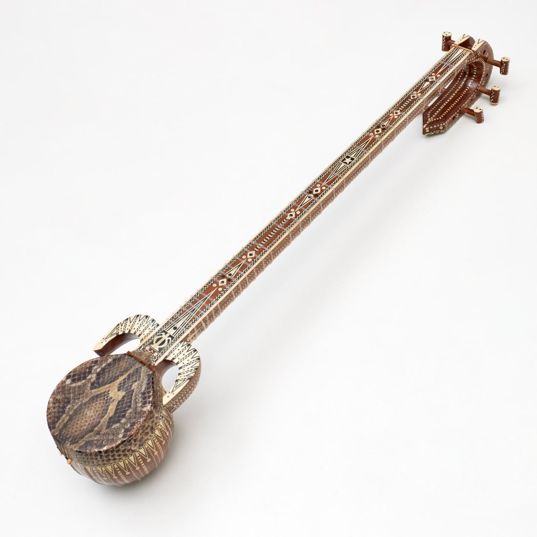 Chinese Rawap string instrument: Chinese Rawap string instrument, 20th c., elaborately inlaid body and neck, snakeskin head, approx. 37"l x 6"w x 5"d