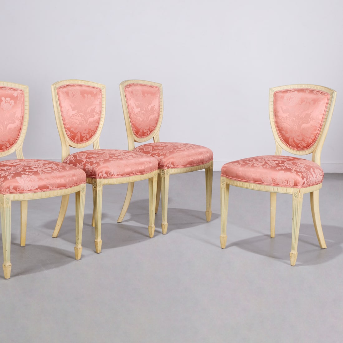 Set (4) George III style painted side chairs: Set (4) George III style painted side chairs, Mid 20th c., pistachio green painted frames with shield back, on fluted and tapering legs, upholstered in pink silk Damask, each 35"h x 20"w x 19"d