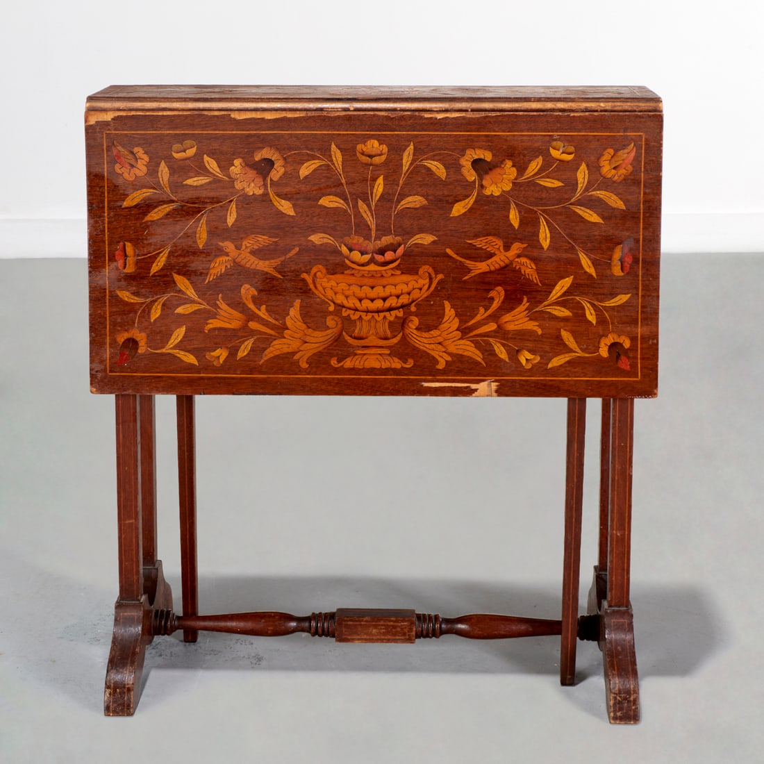 Dutch marquetry drop leaf gateleg table: Dutch marquetry drop leaf gateleg table, Late 19th/Early 20th c., flower urns and vine inlaid decoration, 24"h x 6"w x 22"d (closed), 28"w (open) Provenance: A Private Collection: 1095 Park Avenue,