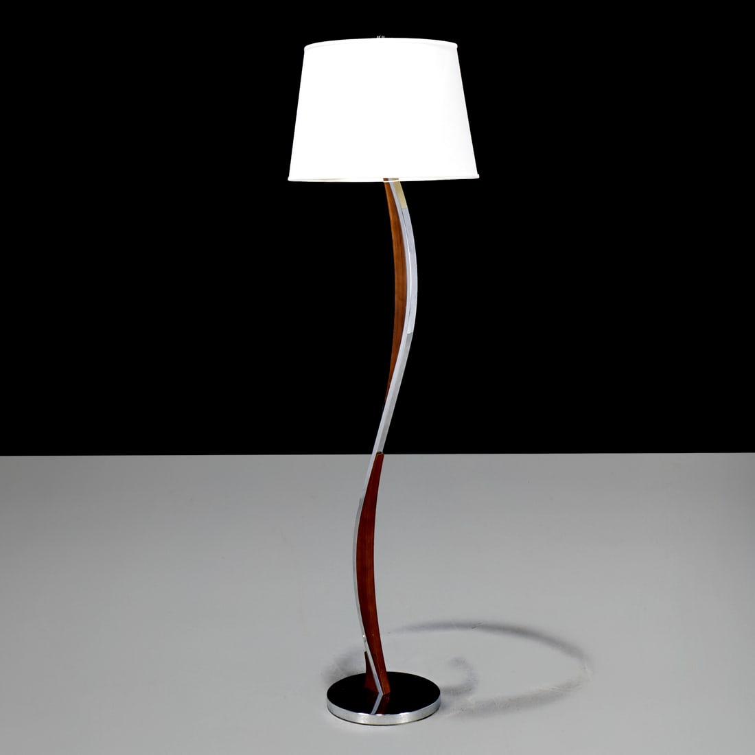 Nova floor lamp: Nova floor lamp, c. 2014, slender curved design, wood veneer and chromed metal, label to underside, 63.25"h x 11"dia (total)