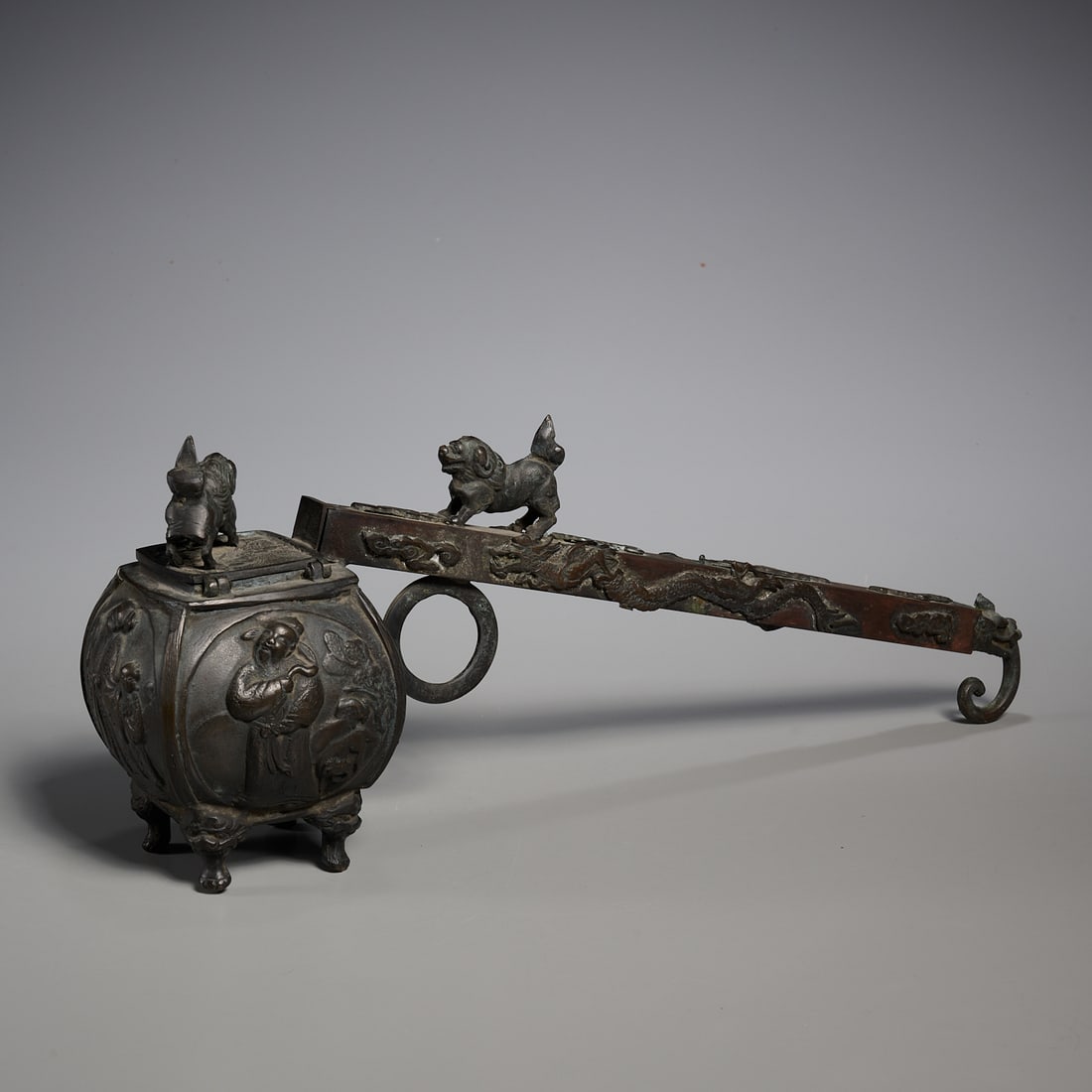 Large vintage Japanese bronze Yatate: Large vintage Japanese bronze Yatate, 20th c., storage vessel for ink and brush, with hinged lid, foo lion, dragon and immortals decoration, four character mark underneath, 6.25"h x 16.5"l x 4"w Prove