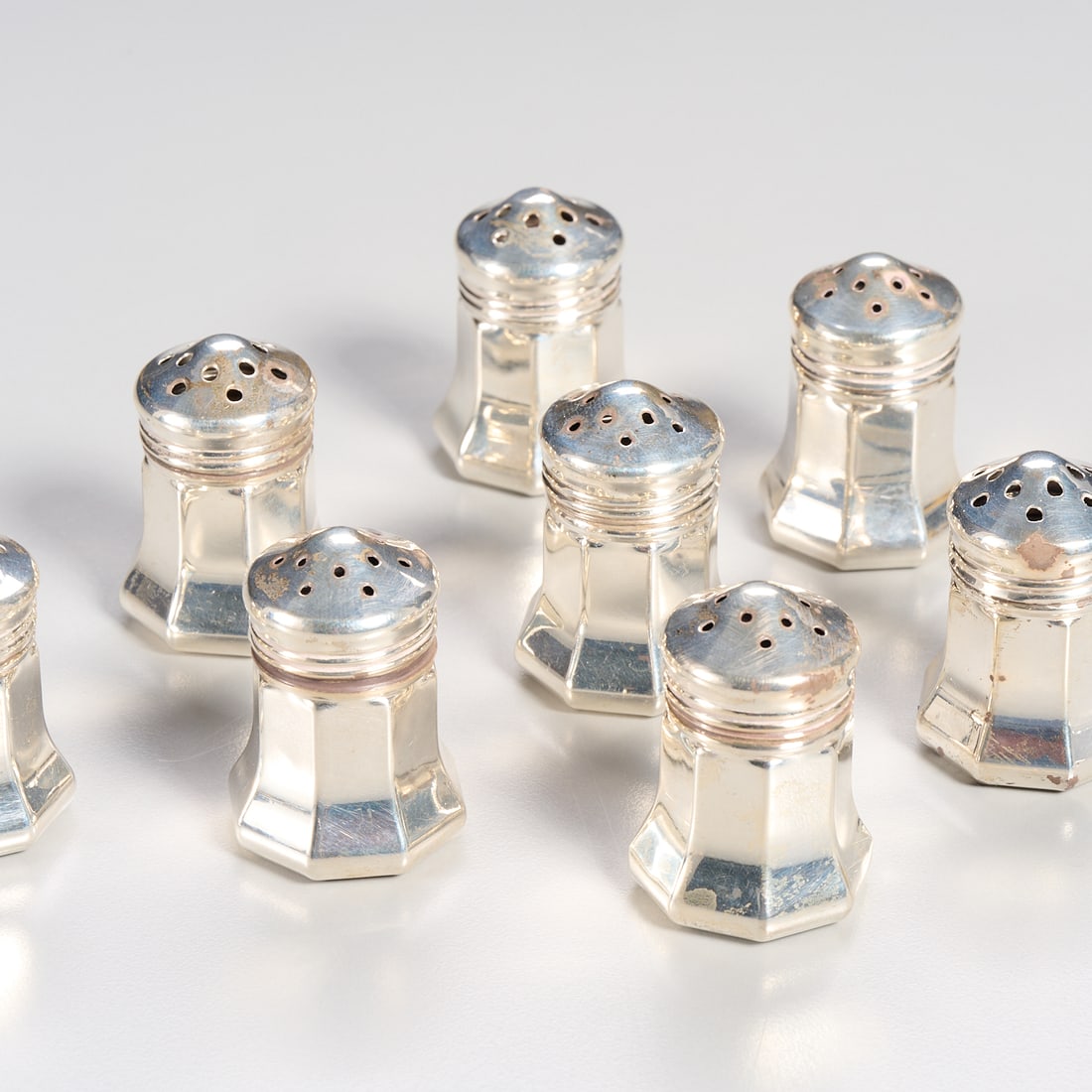 (8) Cartier sterling silver salt & pepper shakers: (8) Cartier sterling silver salt & pepper shakers, 20th c., France, 4 salt and 4 pepper shakers, each marked "Cartier Sterling" underneath, 1.5"h x 1"dia, approx. 1.8ozt Provenance: The Collection of