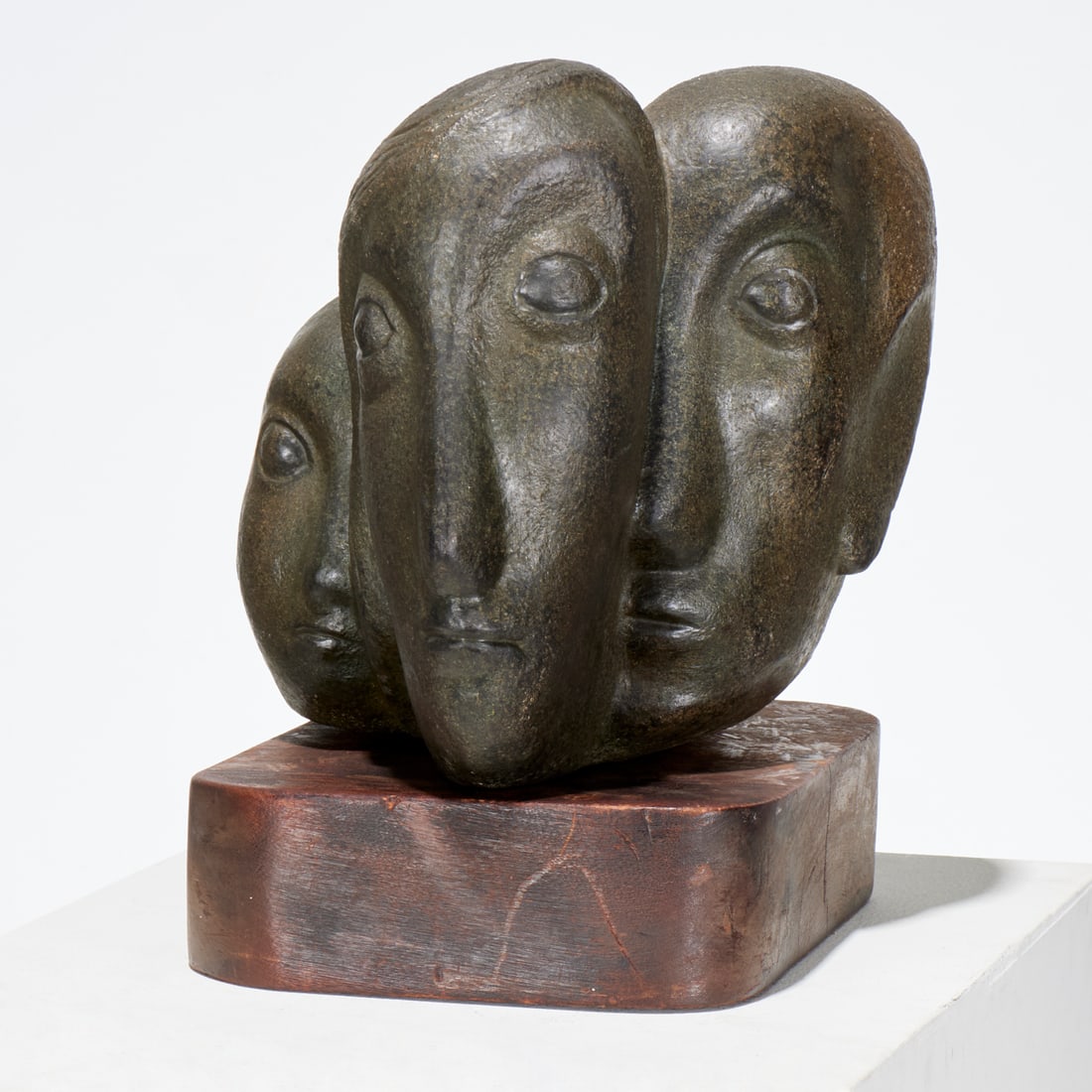 Dorothy Robbins, sculpture: Dorothy Robbins, sculpture, Dorothy Robins (American, 1920-1999), Two Heads, carved stone, metal placard label "D. Robbins" to back, loose on wooden base, 11.75"h x 12"w x 16"d (sculpture), 15"h (incl