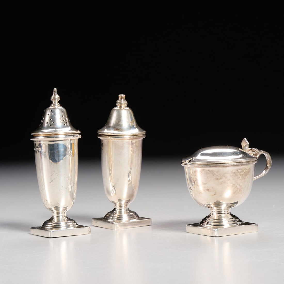 Sheffield silver salt and shaker set: Sheffield silver salt and shaker set, English, 1965-1966, mark of Viner's Ltd. (Emile Viner), incl. a pair of shakers, and a salt with blue-glass insert, each hallmarked, approx. 4"h x 1.25"squ