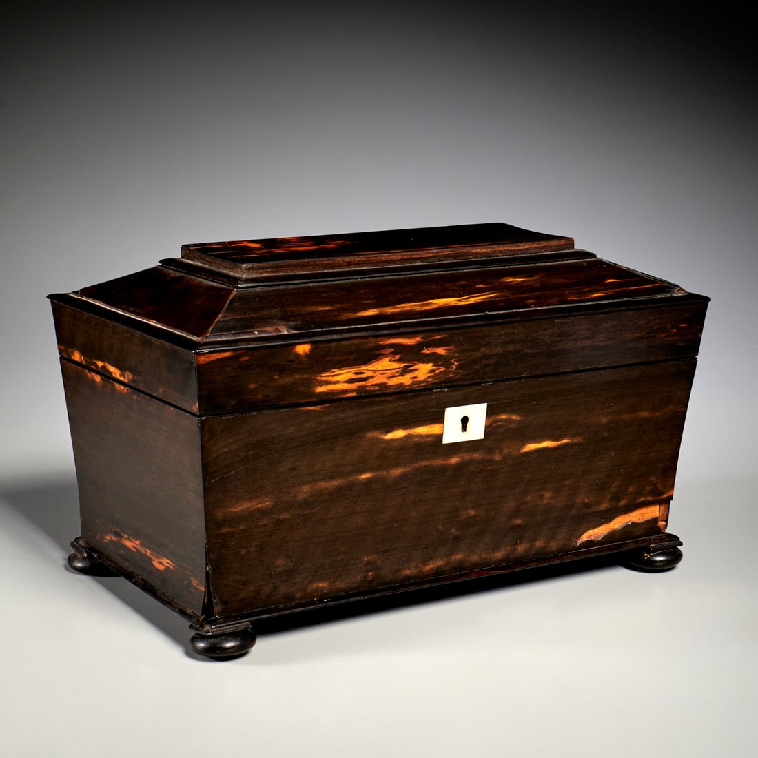 Large English calamander casket: Large English calamander casket, 19th c., with inlaid mother-of-pearl escutcheon and large initials inside lid, raised on bun feet, 8.25"h x 14"w x 8"d Provenance: The Estate of Camilla Dietz
