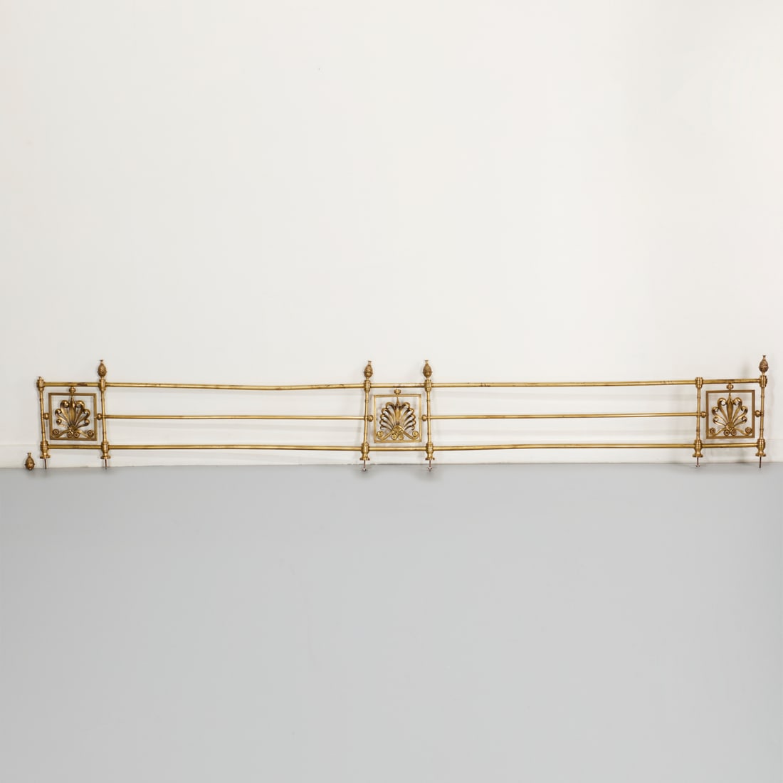 Large Victorian turned brass gallery: Large Victorian turned brass gallery, 19th c., furniture or architectural element, with open scrollwork and pineapple finial, 16"h x 116.5"w (excl. screw elements at bottom)