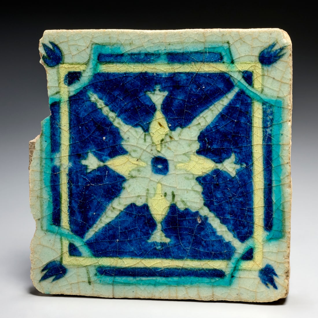 Safavid glazed earthenware tile, ex museum: Safavid glazed earthenware tile, ex museum, 17th c., Iran, blue glaze decorated in geometric pattern, accession number inscribed underside, approx. 7"h x 7.25"w x 1"d Provenance: Works Deaccessioned