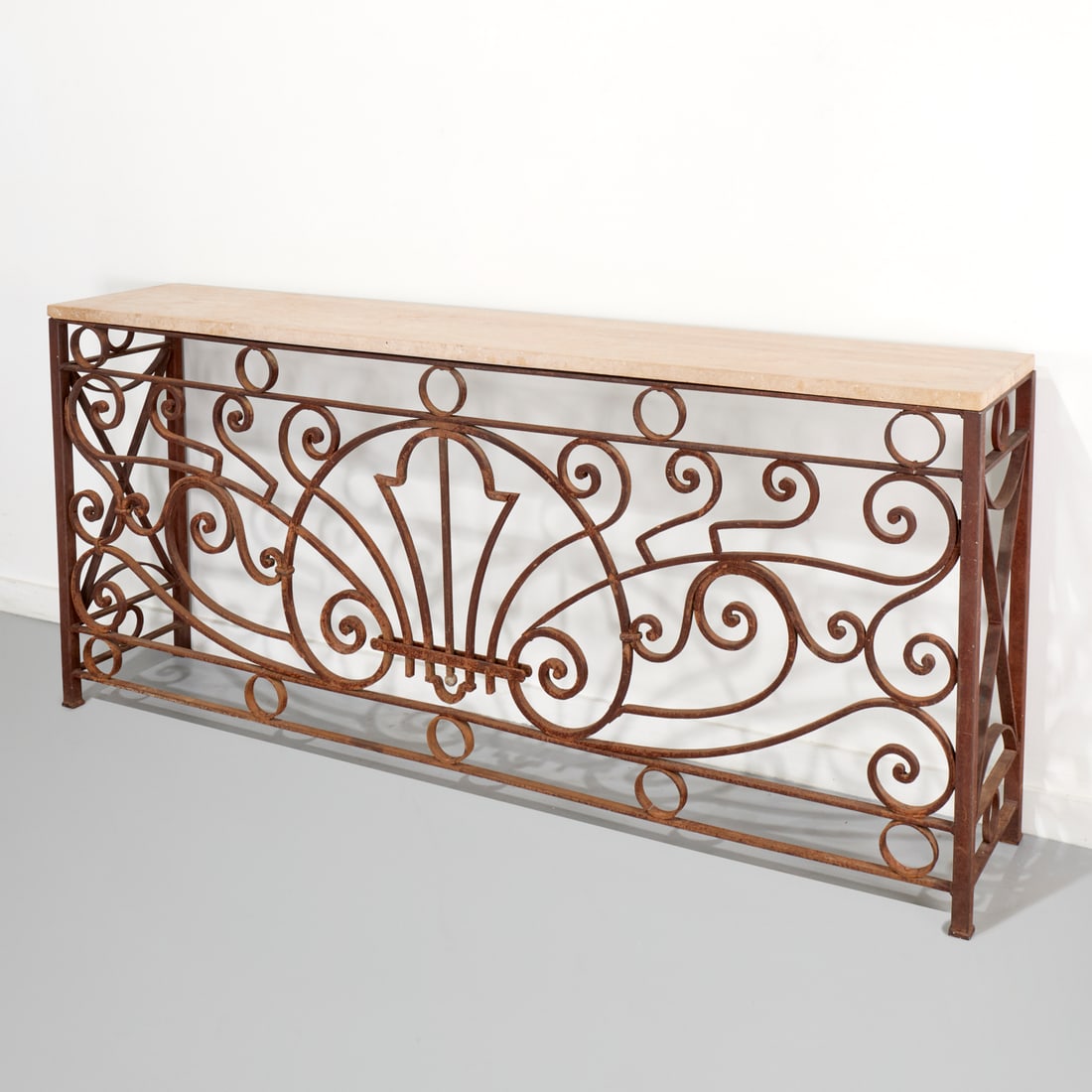 French balcony rail wrought iron console: French balcony rail wrought iron console, 20th c., carved stone top, openwork scrolled design iron base, 38.25"h x 86"w x 16"d
