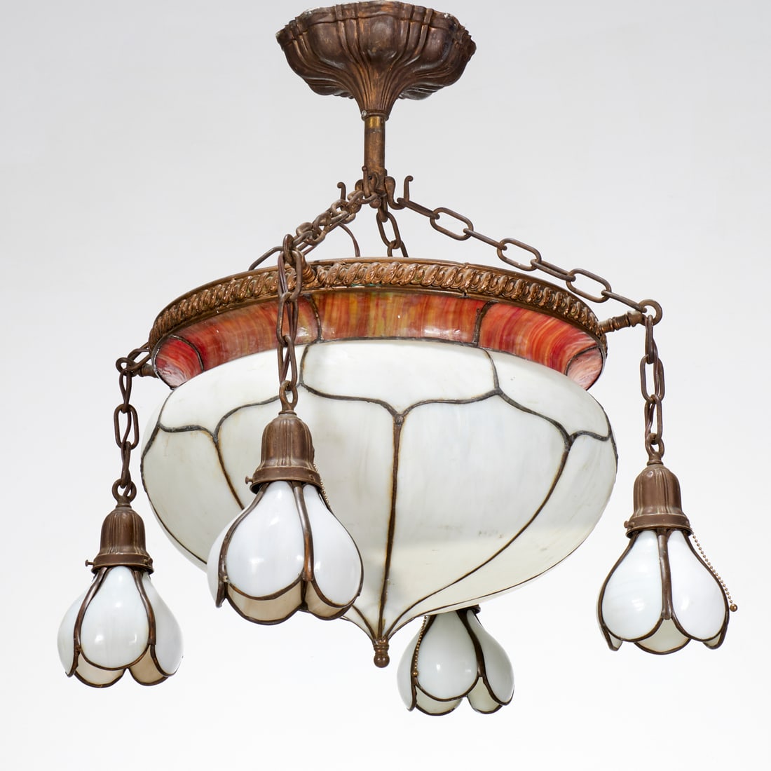 Art Nouveau leaded slag glass chandelier: Art Nouveau leaded slag glass chandelier, First half 20th c., central white dome shade with red slag border and four bulbous lights, approx. 28"h x 20.5"dia