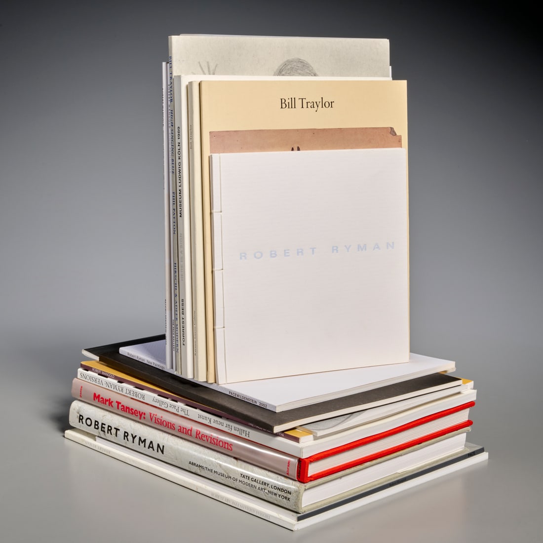(17) Artists Books & Exhibition Catalogues: (17) Artists Books & Exhibition Catalogues, Incl. (5) Robert Ryman, (6) Robert Mangold, (2) Forrest Bess), (3) Bill Traylor, and (1) Mark Tansey, 12.25"h x 10.75"w (largest) Provenance: From an Import