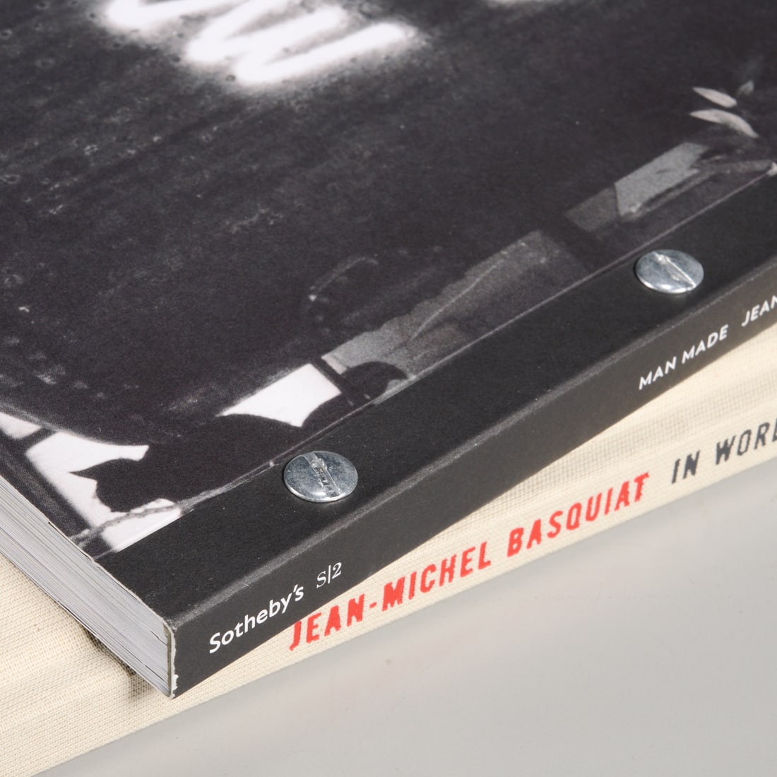 Jean-Michel Basquiat, "Man Made" & "In Word Only": Jean-Michel Basquiat, "Man Made" & "In Word Only", Sotheby's S/2 exhibition catalogue "Man Made", May 2013, softcover with riveted binding, 8.5"squ; Cheim & Read exhibition catalogue "In Word Only",