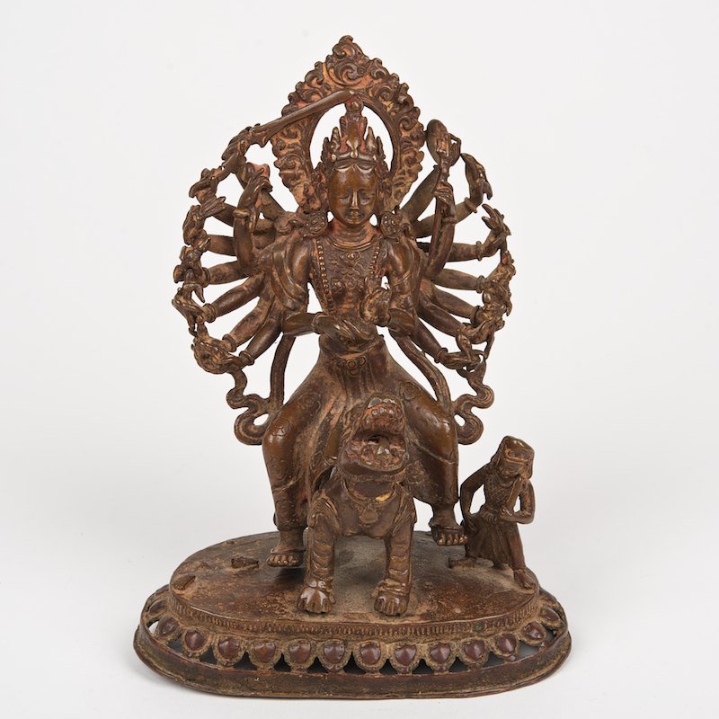 Nepalese bronze/copper figure of Durga: Nepalese bronze/copper figure of Durga, 18th/19th c., cast in two parts, 6.25"h x 4.75"w x 3"d (total)