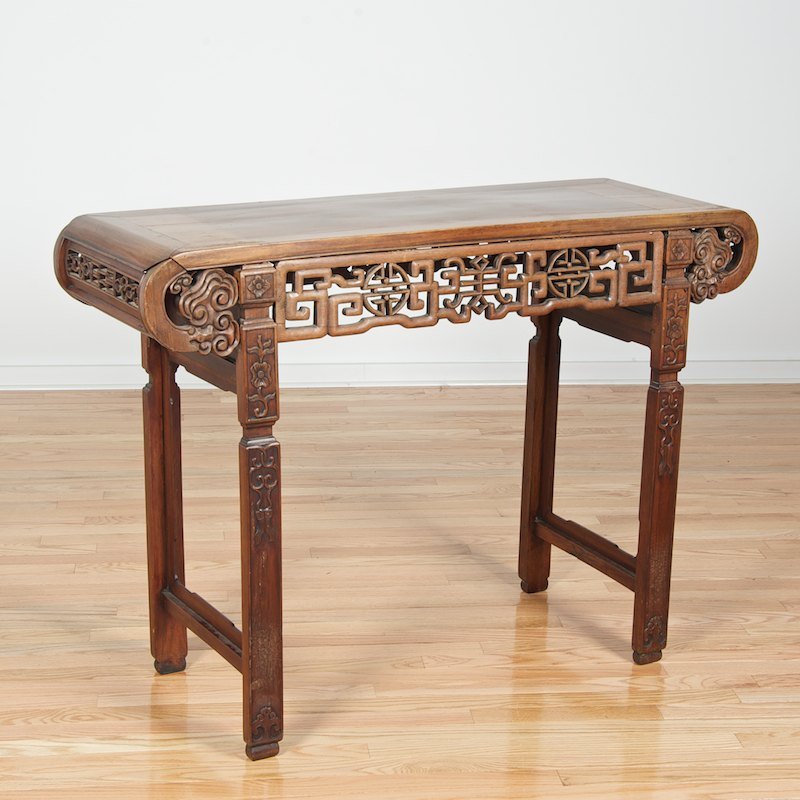 Antique Chinese carved hardwood altar table: Antique Chinese carved hardwood altar table, Qing Dynasty, with pierced archaic fretted apron, 33"h x 46.75"l x 15.5"d