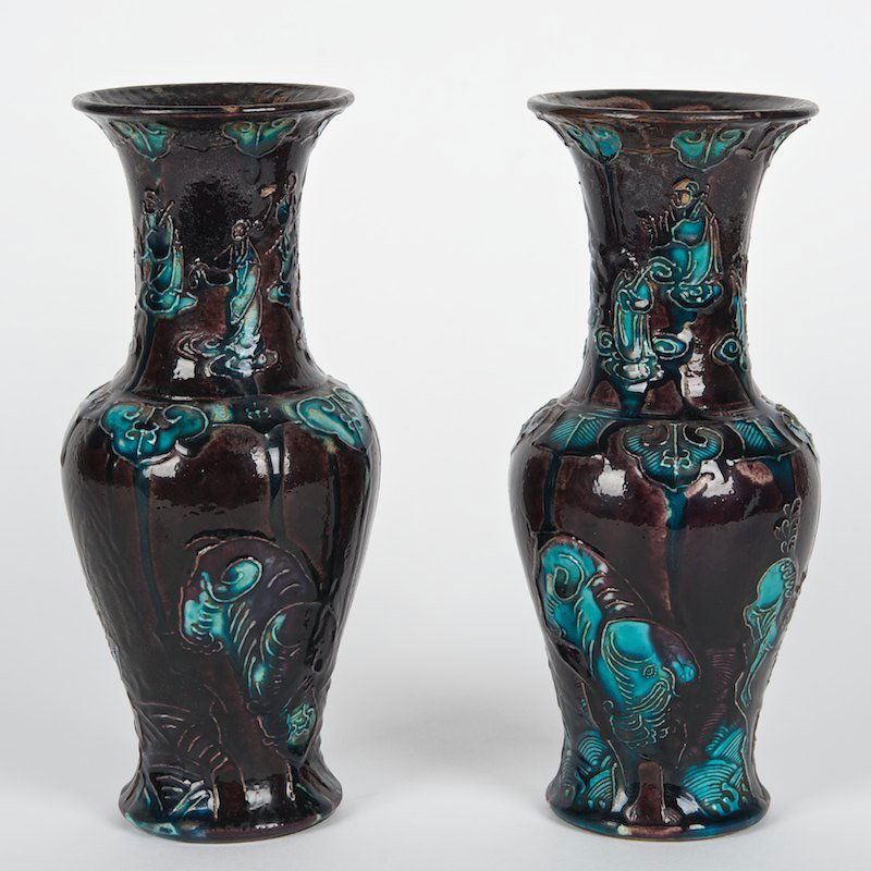 Pair Chinese Fahua glazed earthenware vases: Pair Chinese Fahua glazed earthenware vases, Possibly Ming Dynasty, predominant aubergine glaze, 9.25"h x 4" dia.