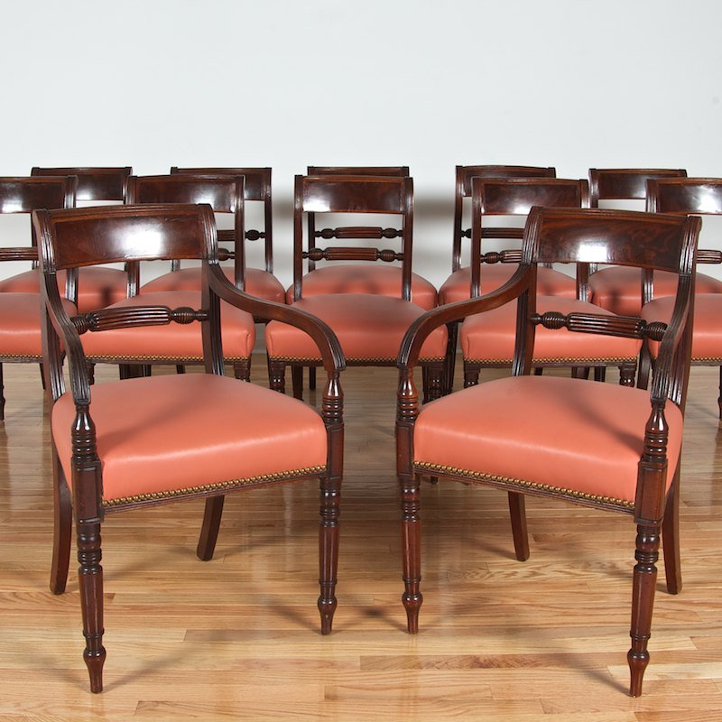 Set (12) George IV mahogany inlaid dining chairs: Set (12) George IV mahogany inlaid dining chairs, 19th c., (2) armchairs and (10) side chairs, close-nailed coral leatherette seats, 33"h x 21"w x 18"d (armchairs), 33"h x 20"w x 17.5"d (side chairs)