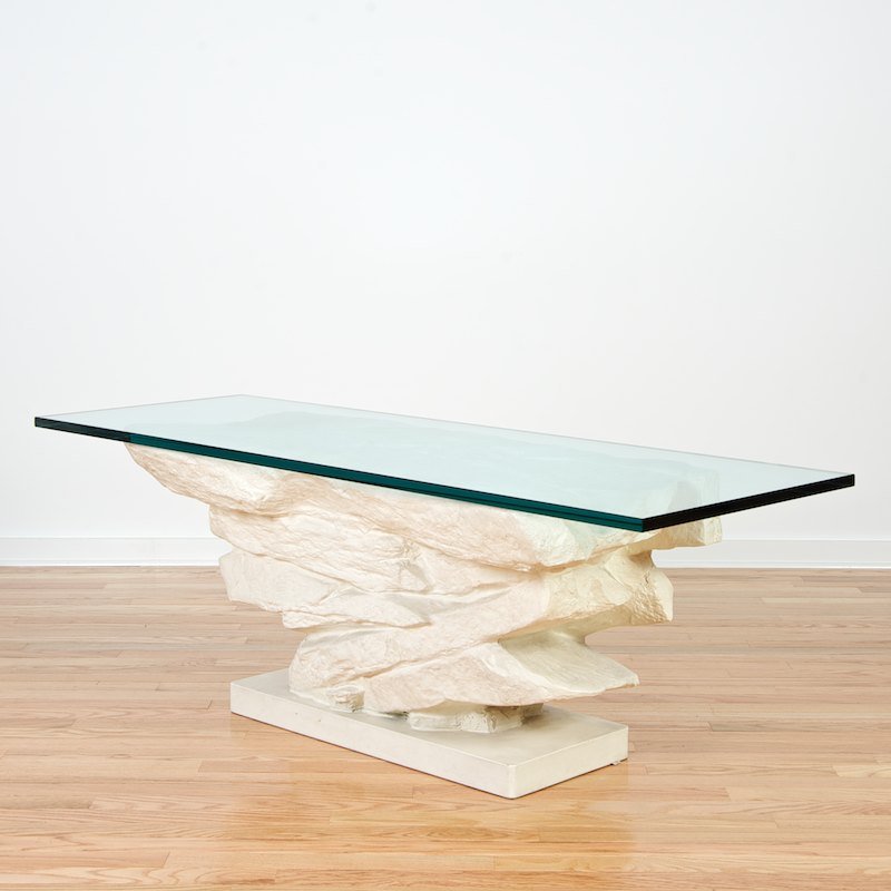 Painted composition coffee table manner of Emilio Terry: Painted composition coffee table manner of Emilio Terry, 20th c., also similar to a John Dickinson design, rockwork base with plate glass top, 19"h x 41"l x 18"d (base only), 20"h x 56.25"l x 19"d (wi