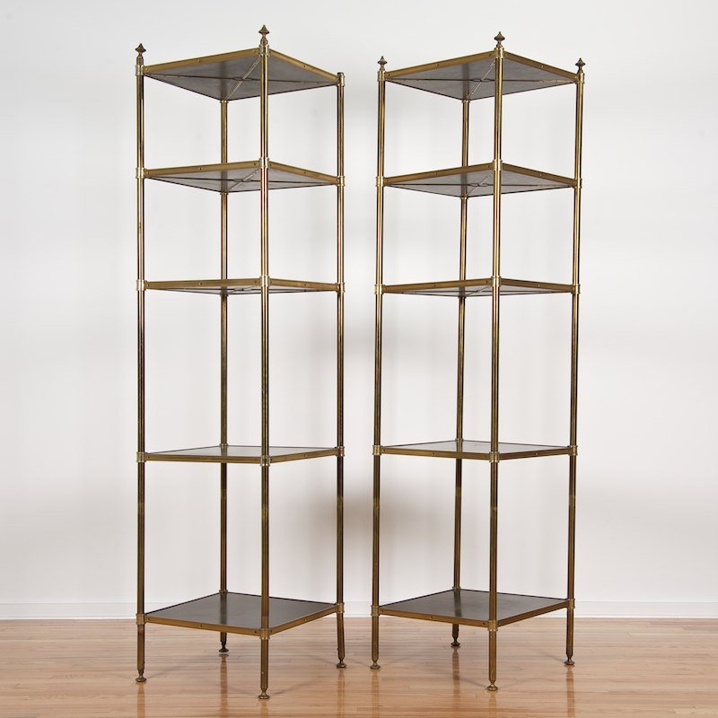 Pair Campaign style brass, ebonized wood etageres: Pair Campaign style brass, ebonized wood etageres, Circa 1940s., in the style of Maison Jansen, five adjustable tiers, 87"h x 21"squ.