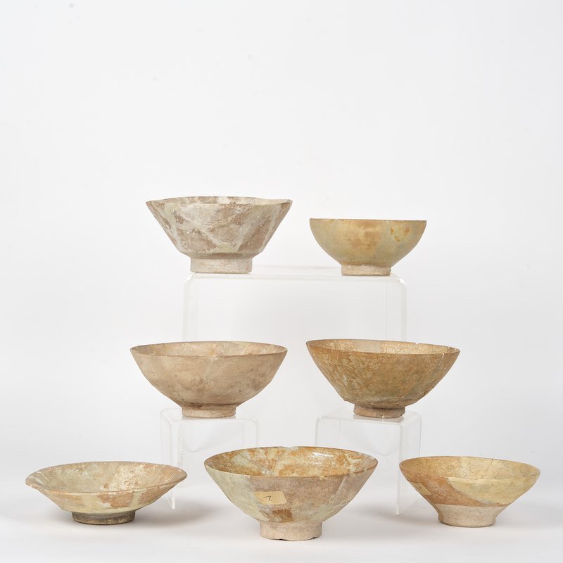 (7) antique Islamic glazed pottery bowls: (7) antique Islamic glazed pottery bowls, Prob. 12th/13th c. Kashan, undecorated, 3"h x 7.25"dia. (largest), 2.5"h x 6"dia. (smallest)