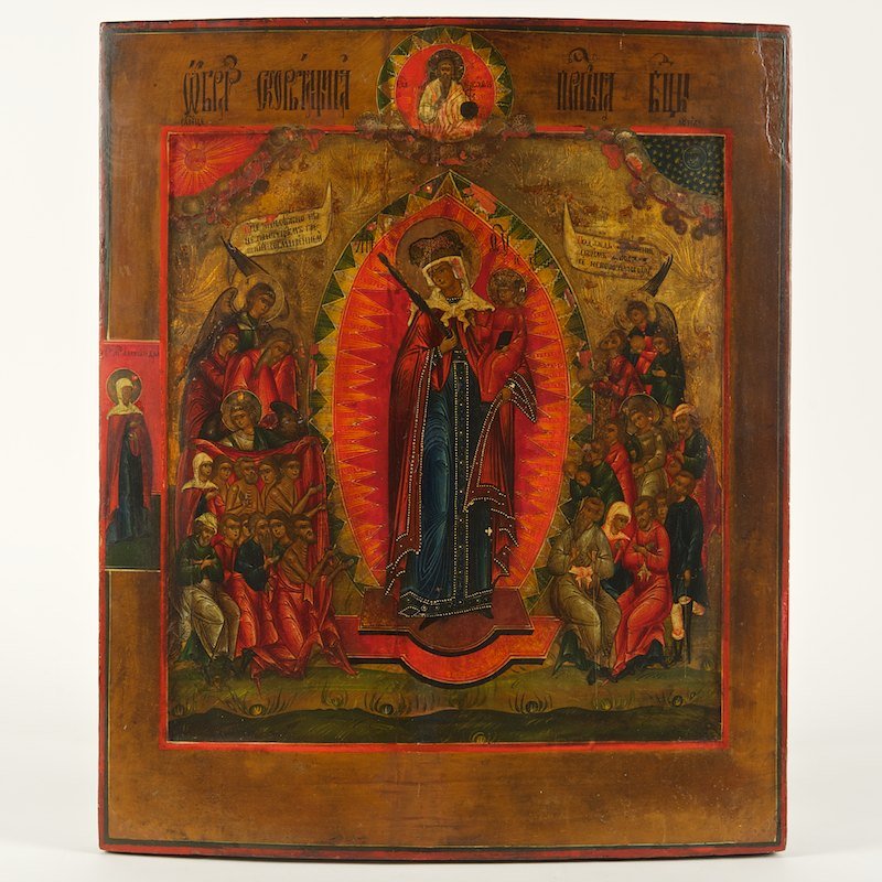 Antique Russian painted and gilt wood icon: Antique Russian painted and gilt wood icon, 18th/19th c., central Virgin and Child flanked by apostles and saints, tempera and gilding on wood panel, inscribed in cyrillic, 21"h x 17.5"w
