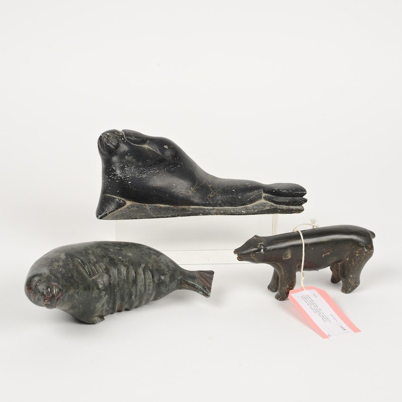 (3) Inuit stone carvings: (3) Inuit stone carvings, 20th c., incl. (2) seals and (1) bear, numbered but not signed, largest: 8.5"l, smallest: 5.5"l (bear)