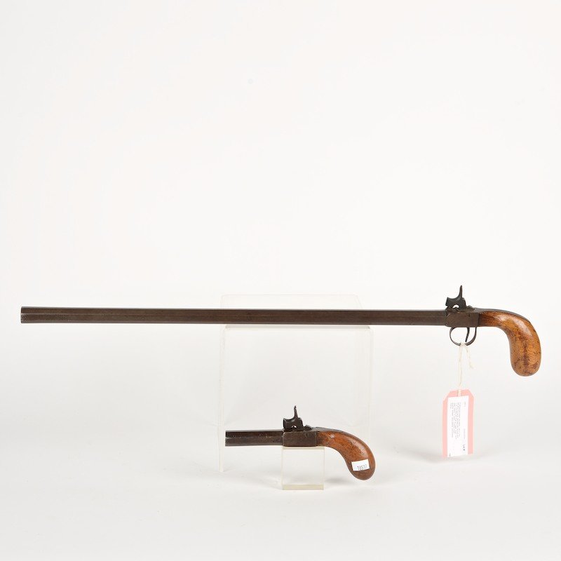 (2) antique percussion cap pistols: (2) antique percussion cap pistols, 19th c., one with extra long barrel, stamped with hallmark and "11.4", the other with drop out trigger, larger: 24.5"l (total), smaller: 7"l (total)