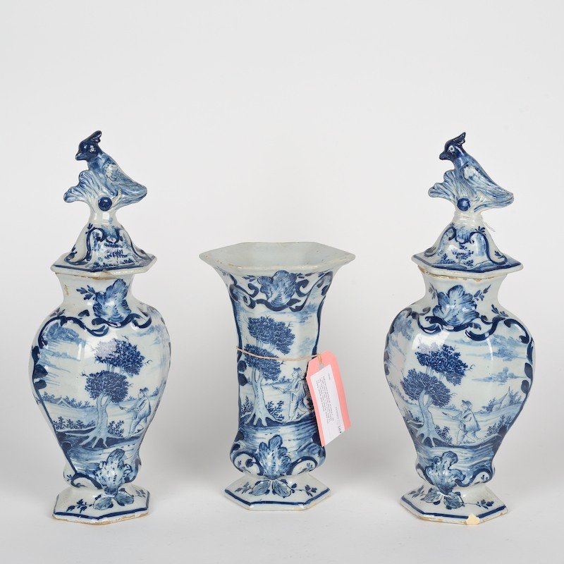 Delft (3) piece garniture marked De Grieksche A.: Delft (3) piece garniture marked De Grieksche A., 18th c., incl. (2) urns and vase, marked "A - DWS", 13.75"h x 6.5"w (urns) , 9"h, 3"w (vase)