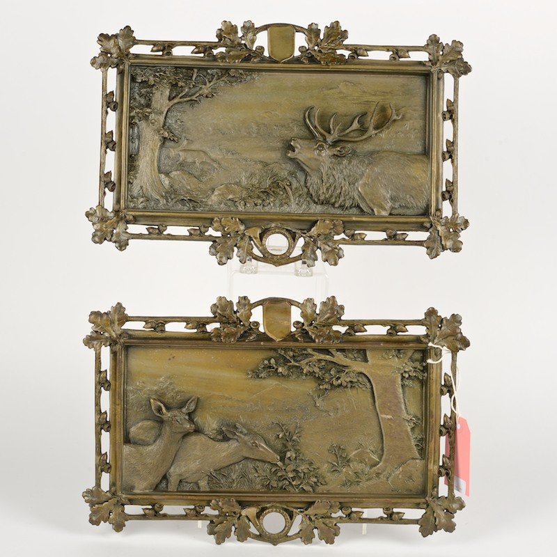 Pair Black Forest style patinated metal game plaques: Pair Black Forest style patinated metal game plaques, 19th c., acorn and branch frames, 10.5"h x 16"l
