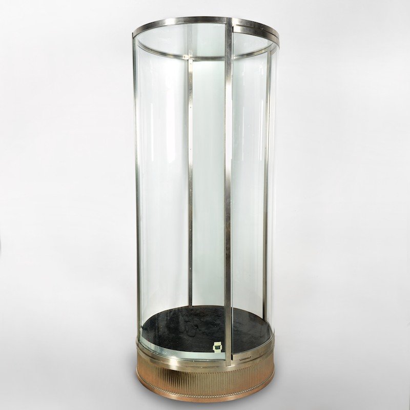 Huge cylindrical glass, steel vitrine from Van Cleef: Huge cylindrical glass, steel vitrine from Van Cleef, 20th c., Art Deco style with black velvet interior, 72"h x 36"dia. Provenance: Van Cleef & Arpels, 744 Fifth Avenue, NY