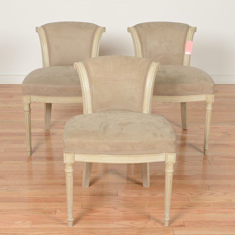(3) Louis XVI style side chairs from Van Cleef: (3) Louis XVI style side chairs from Van Cleef, 20th c., low backs, gray painted with taupe suede upholstery, 27.5"h x 19.5"w x 17.5"d Provenance: Van Cleef & Arpels, 744 Fifth Avenue, NY
