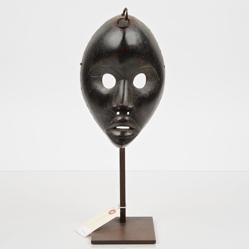 African tribal carved wood mask: African tribal carved wood mask, 20th c., possibly Dan, Ivory Coast, on museum mount, 9.25"h x 6"w x 3"d Provenance: Estate of Glen Sergeon, New York, NY