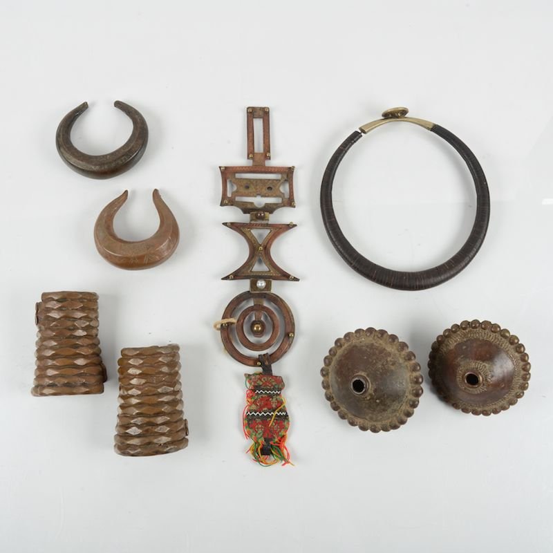 (7) African and Oceanic tribal metalware items: (7) African and Oceanic tribal metalware items, 20th c., incl. an Indonesian Kulabubu necklace, etc., largest: 13"h x 3.75"w x 1d Provenance: From the Rona Family Collections, Princeton, NJ