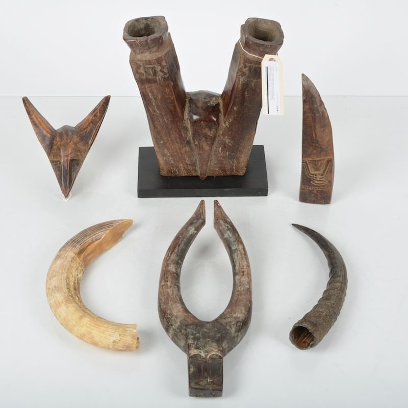 (6) African tribal carved wood and horn items: (6) African tribal carved wood and horn items, 20th c., incl. a water buffalo head and a wood bellows, possibly Bamana, Mali, bellows: 10.75"h x 8.75"w x 2.5"d Provenance: From the Rona Family Collect