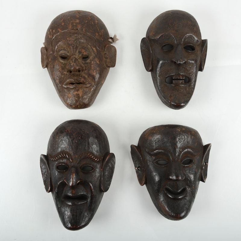 (4) Himalayan carved wood masks: (4) Himalayan carved wood masks, 20th c., possibly Nepalese shaman masks, some with jian ding wax seals, largest: 10.75"h x 8"w x 4"d Provenance: From the Rona Family Collections, Princeton, NJ