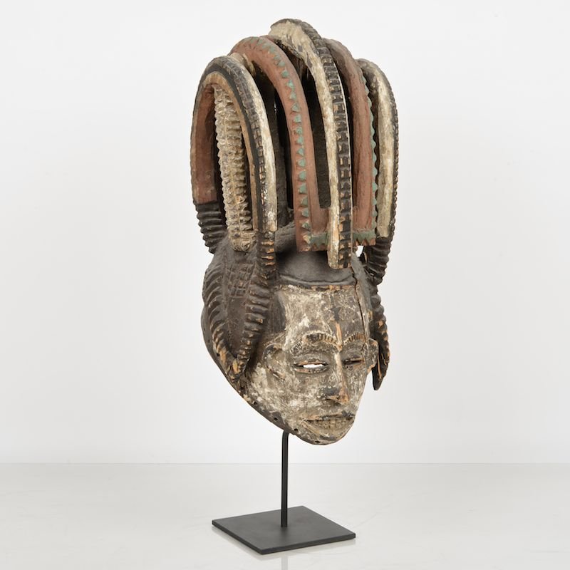 African tribal carved, painted wood helmet mask: African tribal carved, painted wood helmet mask, 20th c., possibly Ibo, Nigeria, on museum mount, 19.5"h x 8.5"w x 10.5"d Provenance: Estate of Glen Sergeon, New York, NY