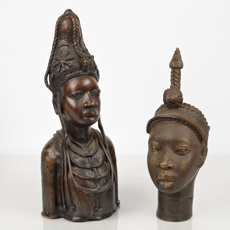 (2) African tribal cast bronze busts: (2) African tribal cast bronze busts, 20th c., Queen Mother type, possibly Benin, Nigeria, larger: 20.25"h x 8.5"w x 7"d Provenance: Estate of Bruce Blickman, Tenafly, New Jersey