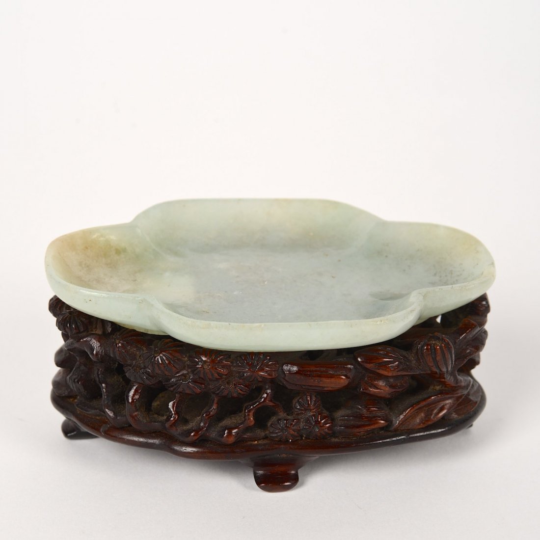 Antique jade quatrefoil dish with inscription: Antique jade quatrefoil dish with inscription, Possibly Ming Dynasty, bears four character Wanli type reign marks, on exceptional carved hardwood stand, 3.5"l x 2.35"w (excl. stand), 1.25"h x 3.5"l x 