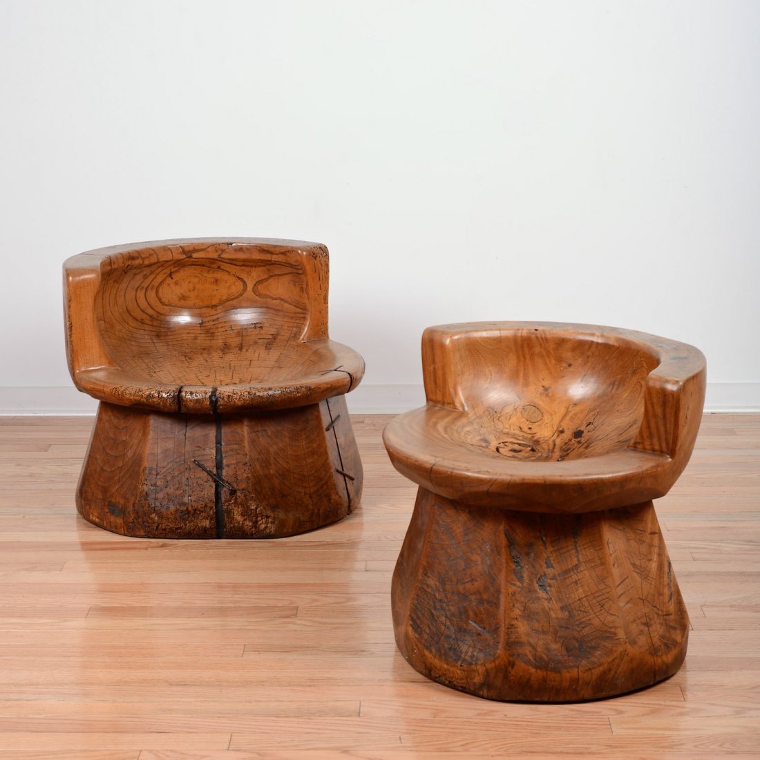 Pair Japanese keyaki wood uzu chairs: Pair Japanese keyaki wood uzu chairs, 18th/19th c., constructed from old rice mortars, 18.5"h x 19"dia. (each)