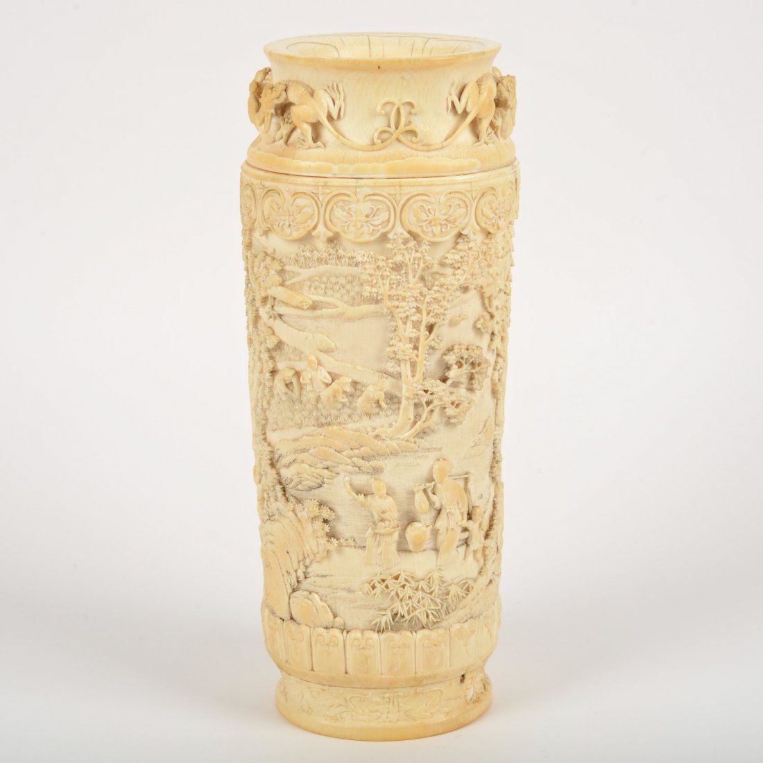 Nice Chinese carved ivory vase: Nice Chinese carved ivory vase, Qing Dynasty, bears yellow lacquer Qianlong seal on underside of foot, decorated with chilong dragons and domestic scenes, 11.5"h x 4.25"w x 3.5"dia.