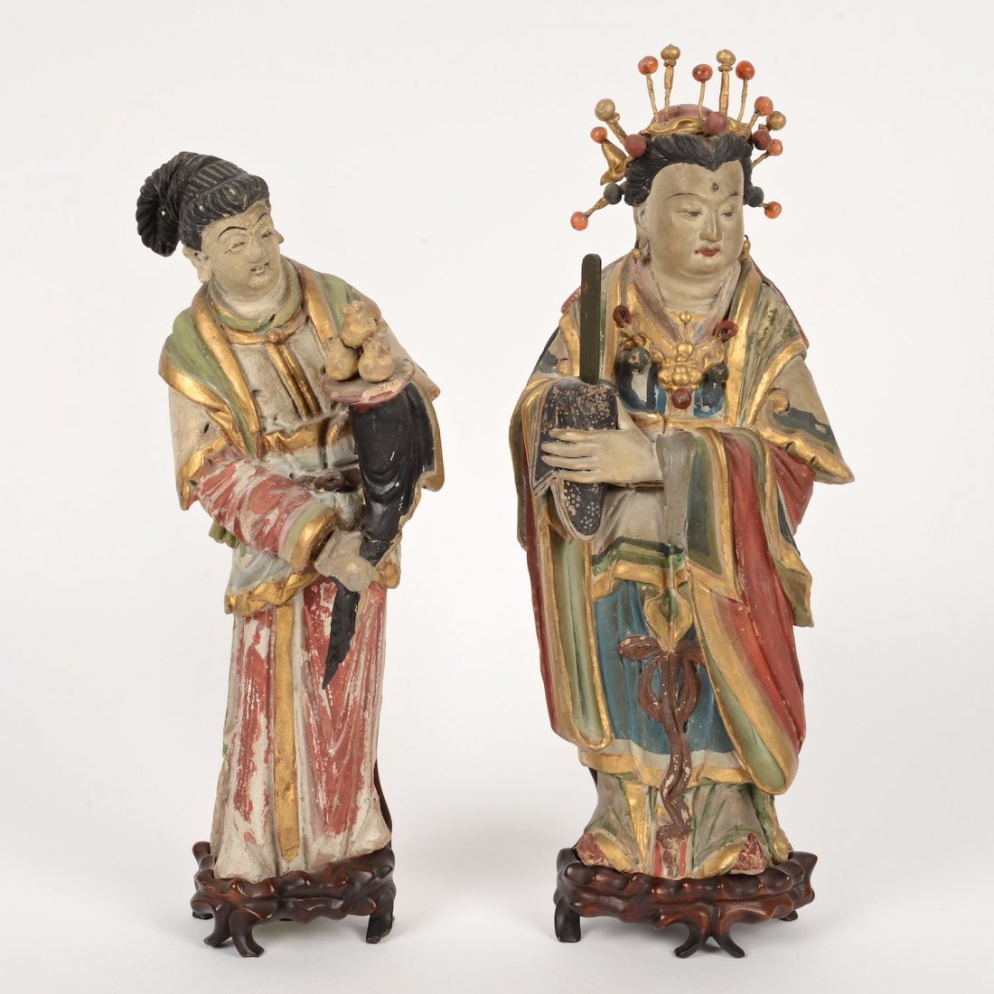 Pair Chinese painted earthenware figures: Pair Chinese painted earthenware figures, 18th/19th c., noble woman and attendant, polychromed terracotta and agate beads, on fitted carved hardwood stands, noble: 13.5"h x 5.5"w (excl. stand), 14.5"h
